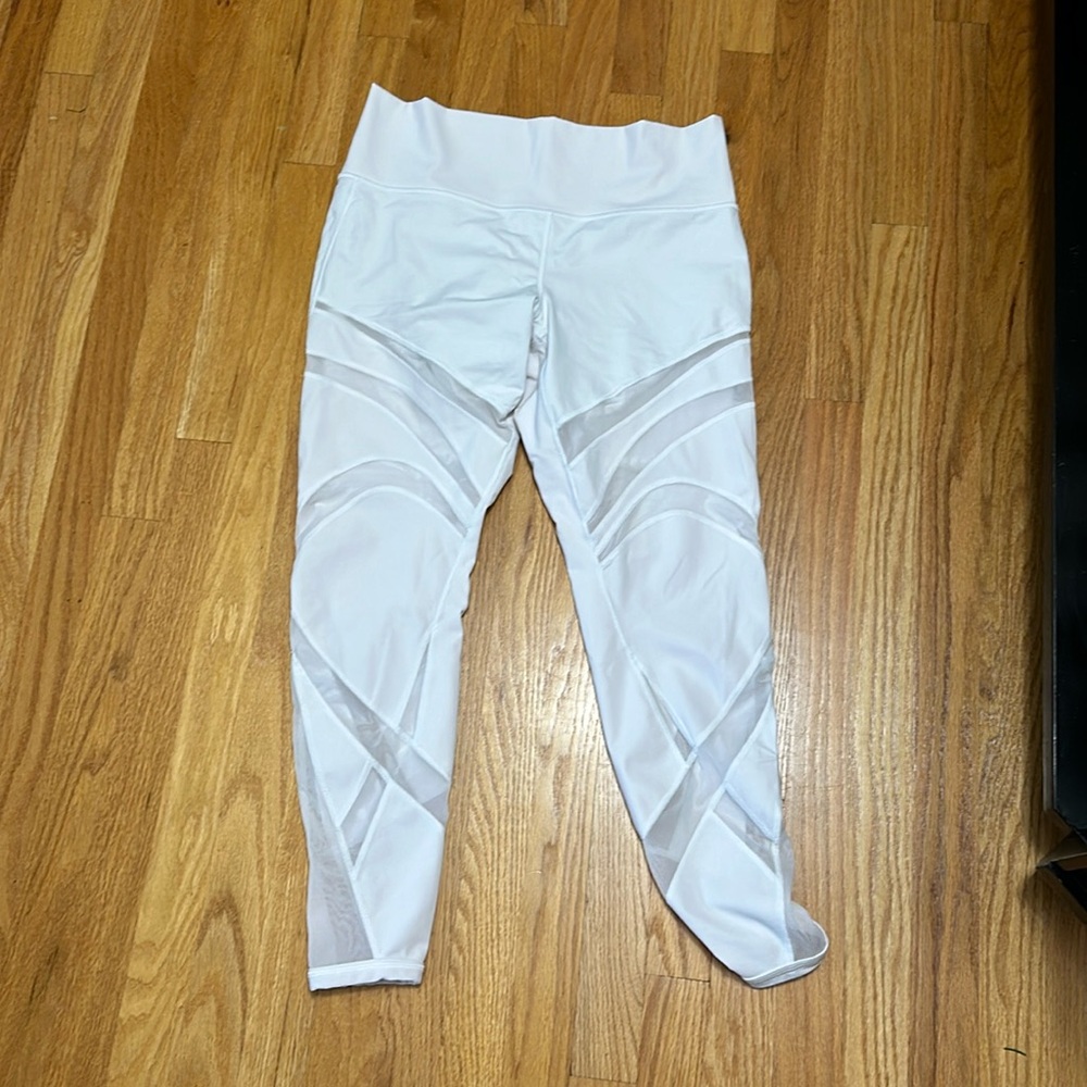 White Lululemon leggings with mesh paneling throughout